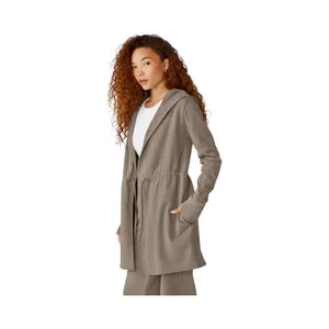 Beyond Yoga-On the go-Cozy Taupe Jacket-size large The first three stock photos are the actual color of the jacket, I had a hard time capturing the exact color in my pictures. Soft and warm taupe jacket. Ideal for comfort and style Open front Cinched waist Hooded Side pockets 67% cotton and 33% polyester Excellent condition thumbnail 2