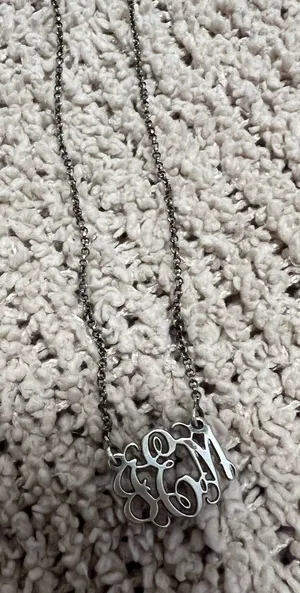 Delicate silver-tone chain with a script monogram pendant. Classic and personalized style. Lightweight and elegant for everyday wear. thumbnail 1