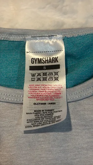 Gymshark Women's Teal and Gray Long Sleeve Crop Top Size Small . Stylish long sleeve crop top by Gymshark. Features a sleek teal and gray design. Perfect for workouts.. NWT thumbnail 4