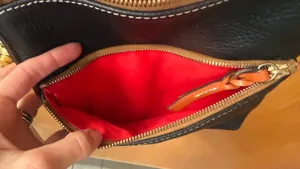 This is a Dooney & Bourke black pebbled leather crossbody thumbnail 7