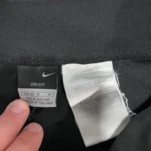 Women’s Nike Dri-Fit Medium Black Workout Pants thumbnail 2