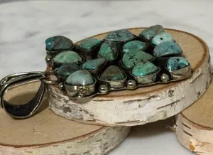 Turquoise cluster pendant set in Tibetan Silver. 14 nuggets, 2”x2” thumbnail 2