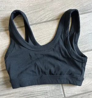 ALO Yoga Black Ribbed Sports Bra with Minimal Logo thumbnail 1