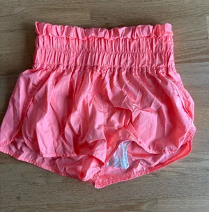FP Movement by Free People Coral Pink Smocked Waist Athletic Shorts thumbnail 1
