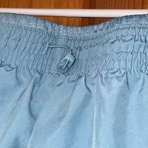 Nike Running Dri-FIT Swoosh mid-rise brief-lined shorts in pale blue size medium thumbnail 7