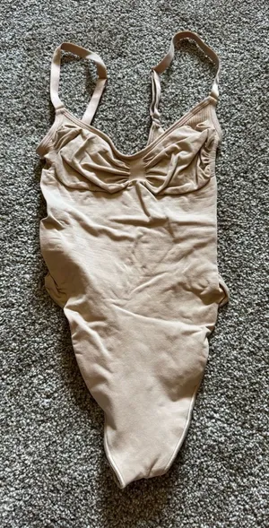 Skims Seamless Sculpting Thong Bodysuit in Clay thumbnail 1