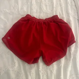 size 2 four inch red lululemon shorts, worn once. thumbnail 1