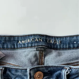 American Eagle Outfitters • Medium Wash Destructed Mom Jeans thumbnail 4