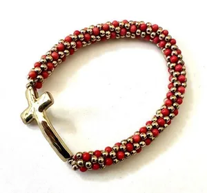 Gold tone and orange beaded stretchy cross bracelet thumbnail 1