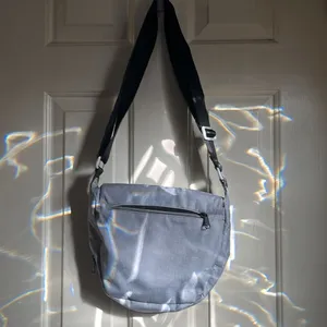 LL Bean purse in gray. The lighting is from the sun through the door. No stains thumbnail 3
