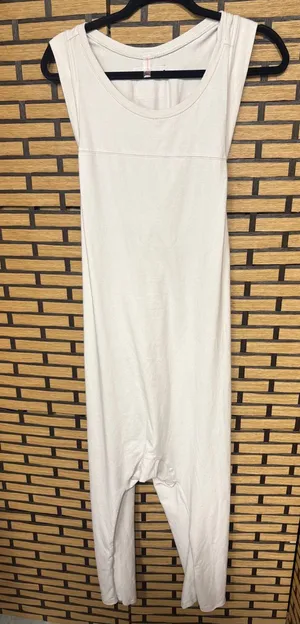 Free people movement tan Hot shot twisted onesie size medium thumbnail 1
