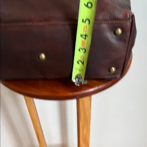 Antonio Valeria is a former Spacious Brown Leather Tote with Minimalist Design thumbnail 8