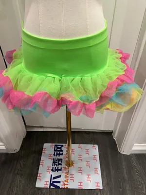 Neon green tutu skirt with pink, blue, and yellow ruffles. One size. Polyester thumbnail 1