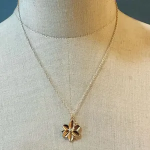 Gold tone flower pendant necklace thumbnail 1