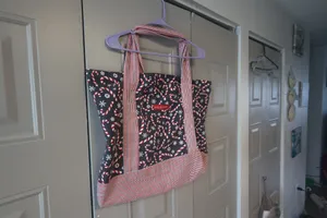 Mia and Tess candy cane and snowflake Christmas tote in black, red and white. thumbnail 3