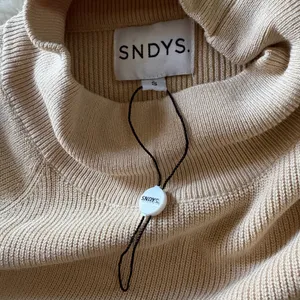 SNDYS tied up mock neck knit tunic dress in sand thumbnail 10
