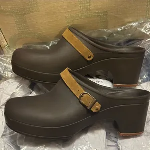 Crocs Sarah clogs in a brown color with a tan suede leather strap thumbnail 6