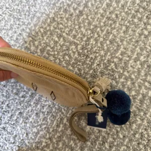 Bloom & Give Tan Round Mini Wristlet with Tassel & Pom Pom’s thumbnail 3