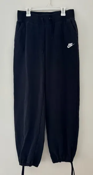 Black Nike sweatpants with drawstring waist and adjustable cuffs thumbnail 1
