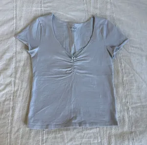 John Galt light blue ruched tshirt with a little lace thumbnail 1