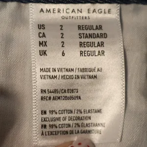 American Eagle Denim Mini Skirt Womens Blue Red Stripe Raw Hem Stretch‎ Size 2 thumbnail 3