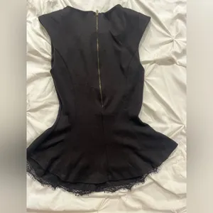Black Sleeveless Peplum Top with Lace Trim thumbnail 2