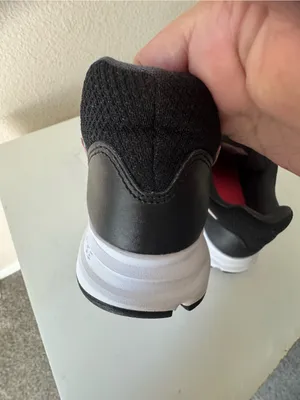 Nike Women's Black Sneakers with Red Swoosh thumbnail 5