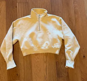 TNA Perfect Cozy Fleece Cropped Pullover in Light Yellow thumbnail 1