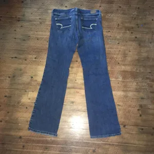 American Eagle stretchy cowboycore distressed slim boot jeans thumbnail 3