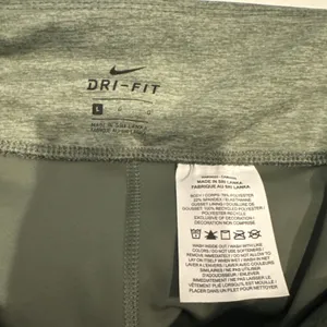 Nike Dri Fit 3/4 Length Compression Tights Pants Women's Large Green Running Gym thumbnail 3
