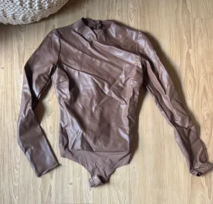 Skims Faux Leather Long Sleeve Bodysuit thumbnail 1