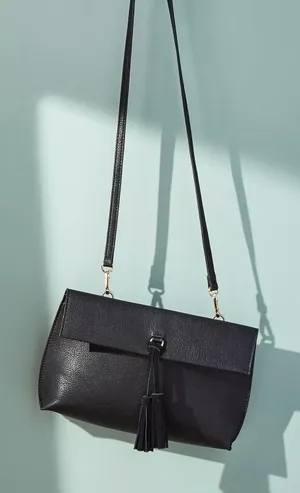 Anthropologie Dreia Envelope Crossbody Bag Black Medium Bag Tassel Faux Leather thumbnail 1