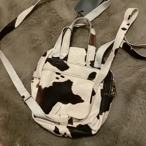 MOVING SALE!! NWT Cow print mini backpack! thumbnail 2