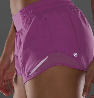 Lululemon • magenta glow hotty hot shorts sz 12 thumbnail 1