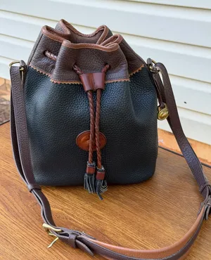 Vintage Dooney & Bourke All Weather Leather Black Brown Drawstring Bucket Bag thumbnail 1