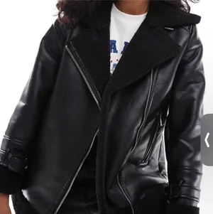 Women’s black shearling jacket thumbnail 1