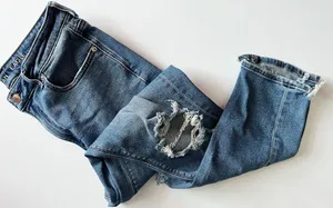 American Eagle Outfitters • Medium Wash Destructed Mom Jeans thumbnail 1