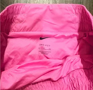 pink Nike One Dri-FIT running shorts with an elastic waistband and brief lining thumbnail 3