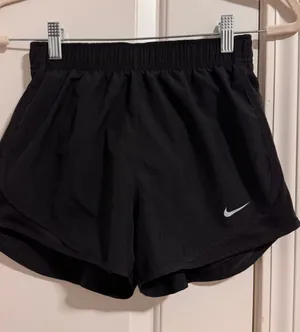 Nike Black Women's Athletic Running Shorts with White Swoosh thumbnail 1