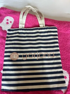 Stylish Gorjana tote bag featuring navy and cream stripes. Perfect for everyday use. thumbnail 1