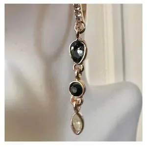 Gold tone hoop earrings with dangling rhinestones thumbnail 8
