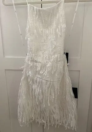 Lulu’s Making Magic White Fringe Lace-Up Mini Homecoming Dress thumbnail 1