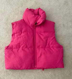 Pink puffy vest thumbnail 1
