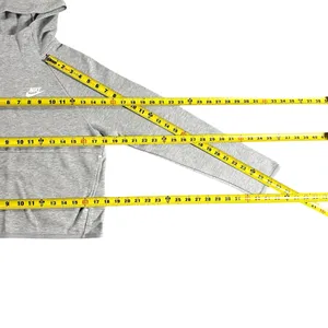 Nike Gray Minimalist Hoodie XS Y2K Athleisure Streetwear Description: Soft gray Nike hoodie with embroidered logo and kangaroo pocket. Perfect minimalist, gorpcore, streetwear, gym, and casual layering essential. Pre-owned Condition: Excellent Flaws: No significant flaws observed. Stored: Model created by AI. NikeHoodie Streetwear Athleisure MinimalistStyle Gorpcore HeatherGray Pullover LogoHoodie Layering Y2K thumbnail 6