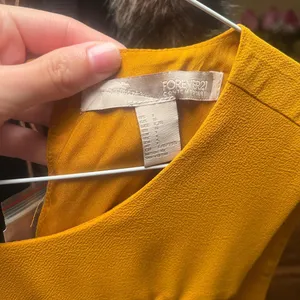Forever 21 Yellow midi dress with lace in front #yellowdress #mididress Never worn and comes with extra button Size L but fits like a Medium thumbnail 2