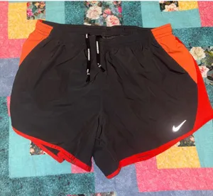 Nike Dri-FIT Running Athletic Shorts Woman’s Size Small Black and Red With Liner thumbnail 1