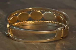 Gold tone open hinged bangle with oval black stones thumbnail 5