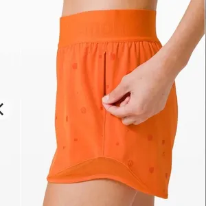 Lululemon Hotty Hot Short 4" *Logo Poco Logo Foil Amber Orange Size 4 thumbnail 2