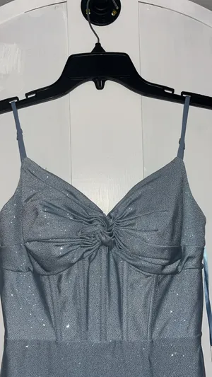 Stacees dusty blue, glittery, mid-length dress, with corset rib design, and knot design on chest, with bra padding built in. thumbnail 5