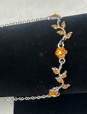 Silver Floral Bracelet with Bright Orange Crystal Accents thumbnail 1